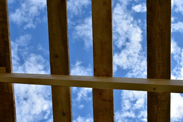 rafter system against the background of clouds
