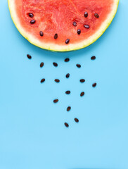 Creative food health diet concept photo of sliced watermelon fruit on blue background. © Sasha_Brazhnik