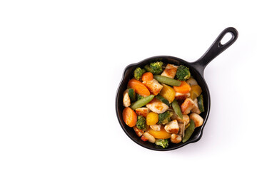 Stir fry chicken with vegetables on iron pan isolated on white background. Top view