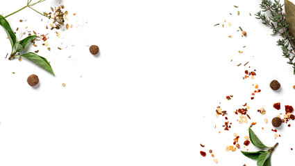 Various spices and herbs on a white background top view. Free space for text. Food background,...