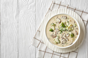 Mushroom Broccoli Cheese Soup in a white bowl