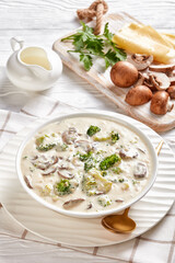Mushroom Broccoli Cheese Soup in a white bowl