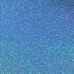 Blue pink green colors foil paper texture background.