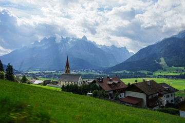 Dobbiaco Church in Val Fiscalina on a cloudy summer day, Dolomites, Unesco, Trentino Alto Adige, Sudtirol, Italy