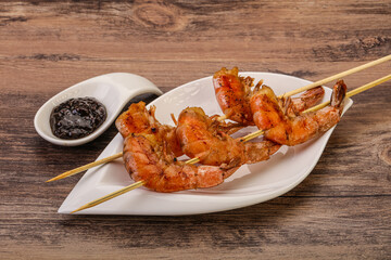 Grilled prawn skewer with pepper sauce