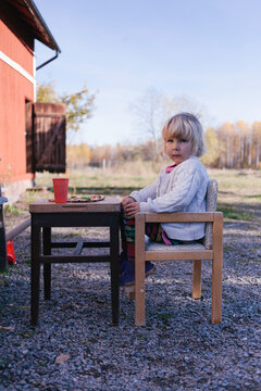 Young girl having a pizza for lunch.