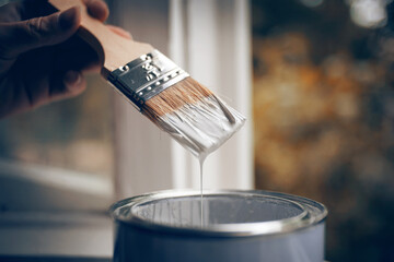 Brush in white paint. - 375658445