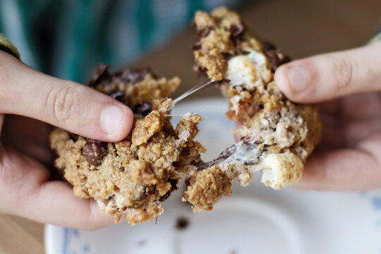 Child eating gooey cookie