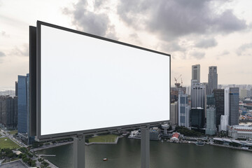 Fototapeta premium Blank white road billboard with Singapore cityscape background at sunset. Street advertising poster, mock up, 3D rendering. Side view. The concept of marketing communication to sell idea.