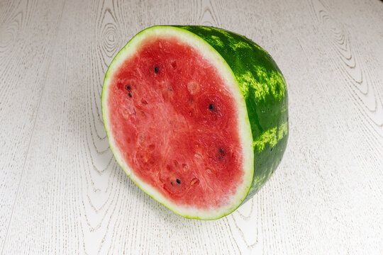 Halves of a ripe watermelon on a white background. Isolated