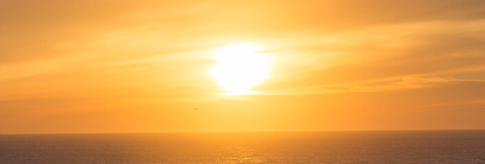 banner of sunset above sea in orange and yellow