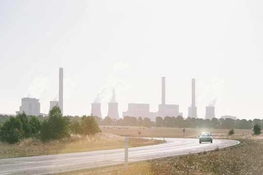 Lone car on a Road near Power Plant
