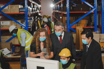 Obraz na płótnie Canvas Manager with worker team working warehouse. During working hours in the warehouse, there is a checking, checking, stock for quality products, safe for customers. Women worker in warehouse concept.