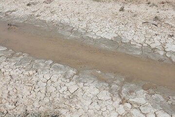 Water trickling through an irrigation canal during an extreme drought