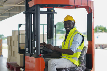 male forklift operator in warehouse,A male lifter in a warehouse, a smiling and friendly worker.