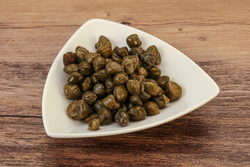 Tasty capers in the bowl