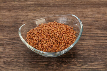 Raw buсkwheat cereal in the bowl