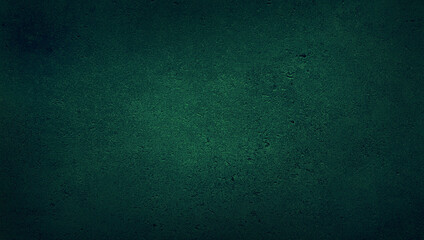 blank green texture surface background with dark corners. green grainy cement wall background with...