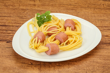 Kids pasta spaghetti with sausages