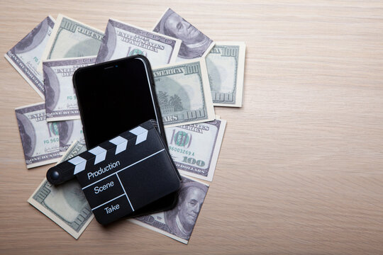 image of mobile phone clapper board money banknote 