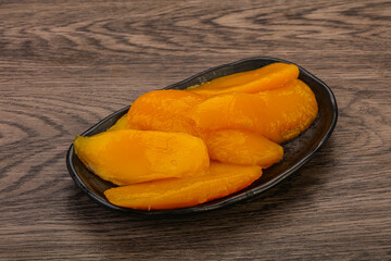 Sweet mango slices in syrop