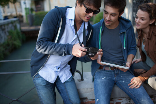 Friend Together With Tablet Cellphone and Camera