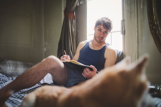 Man Drawing a Sketch of Pet Dog