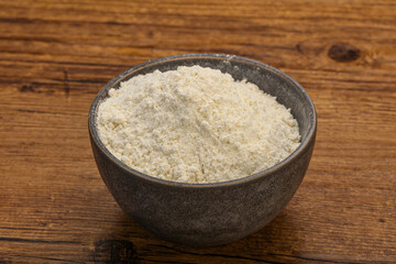 Wheat flour heap in the bowl