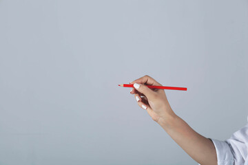 woman hand red  pencils