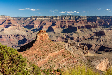 View over Grand Canyon in a sunny day with little clouds in the sky at Cedar Ridge along the South Kaibab trail connecting the north rim to river Colorado - Grand Canyon National Park, AZ - USA