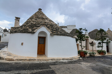 A trullo ( trulli) is a traditional Apulian dry stone hut with a conical roof. In the town of Alberobello, whole districts contain dense concentrations of trulli. Italy
