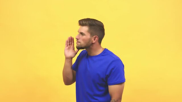 Young caucasian handsome man whispering gossip undertone, trying not to be heard