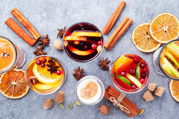 Various autumn or winter seasonal alcohol hot cocktails - mulled wine, glogg, grog, eggnog, warm...