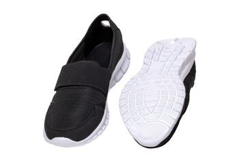 Mans black shoes. Close-up of a pair of black sneakers or sport shoes isolated on a white background. Elegant and trendy mens footwear. Macro.