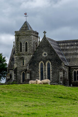 Fototapeta na wymiar Old british church on the green pasture