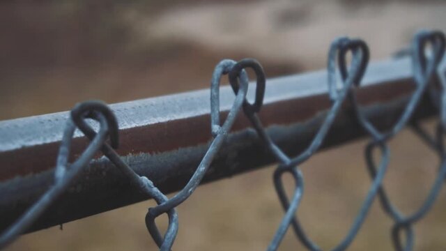 Slow motion clip of a chain link fence