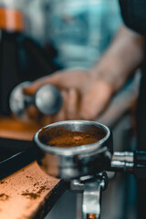 Fototapeta na wymiar close up of a hand holding a coffee grinder