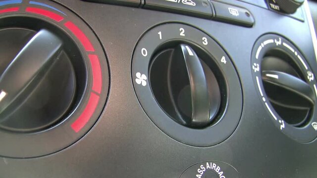 Adjusting Air Conditioning Vehicle. HD. Close-Up