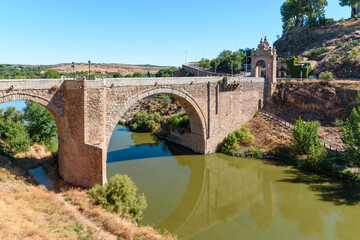 Fototapeta na wymiar Alcantara Medieval Bridge over Tagus River in Toledo, Castilla La Mancha