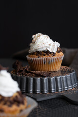 Homemade muffins with coffee and cinnamon. Food still life, dark mood.