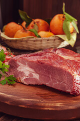 Piece of bacon on the wood cutting board - Close-up