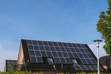 Fototapeta premium photovoltaic modules on a gable roof