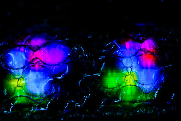 Fototapeta na wymiar abstract background created with a colorful image through a sheet of plastic bubble wrap
