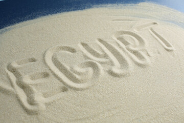 Fototapeta na wymiar Words and symbols in the sand