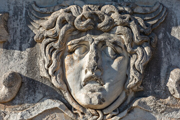 Antique relief representing head of Medusa, in the ruins of the Temple of Apollo in Didyma, Aydin, Turkey