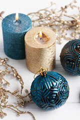 Blue and golden aroma candles and Christmas toys