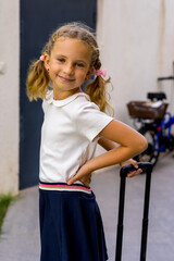  Portrait of happy caucasian young girl going to school. Closeup face of smiling schoolgirl looking at camera.