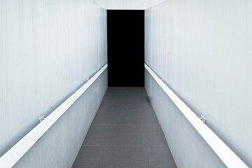 Concrete corridor with white wall and granite tile