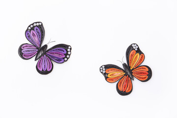 Top view of beautiful butterflies, isolated on white background. Hand made of paper quilling technique.