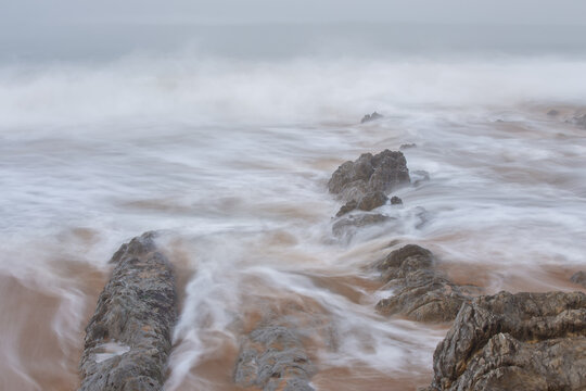 Landscape with fog in the Portio Beach. Liencres. Cantabria. Spain.